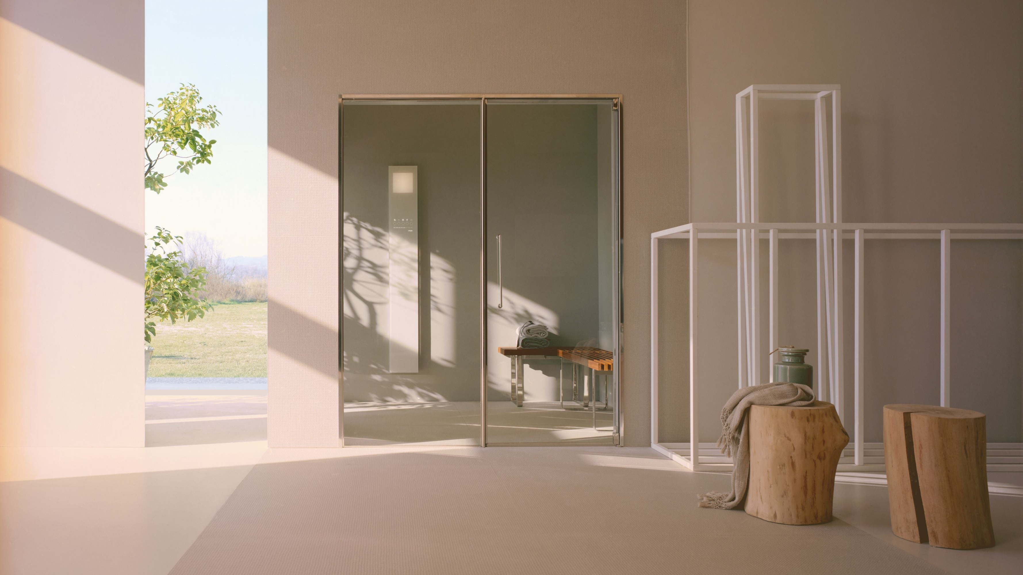 Modern interior with a glass door spa leading to an outdoor area.