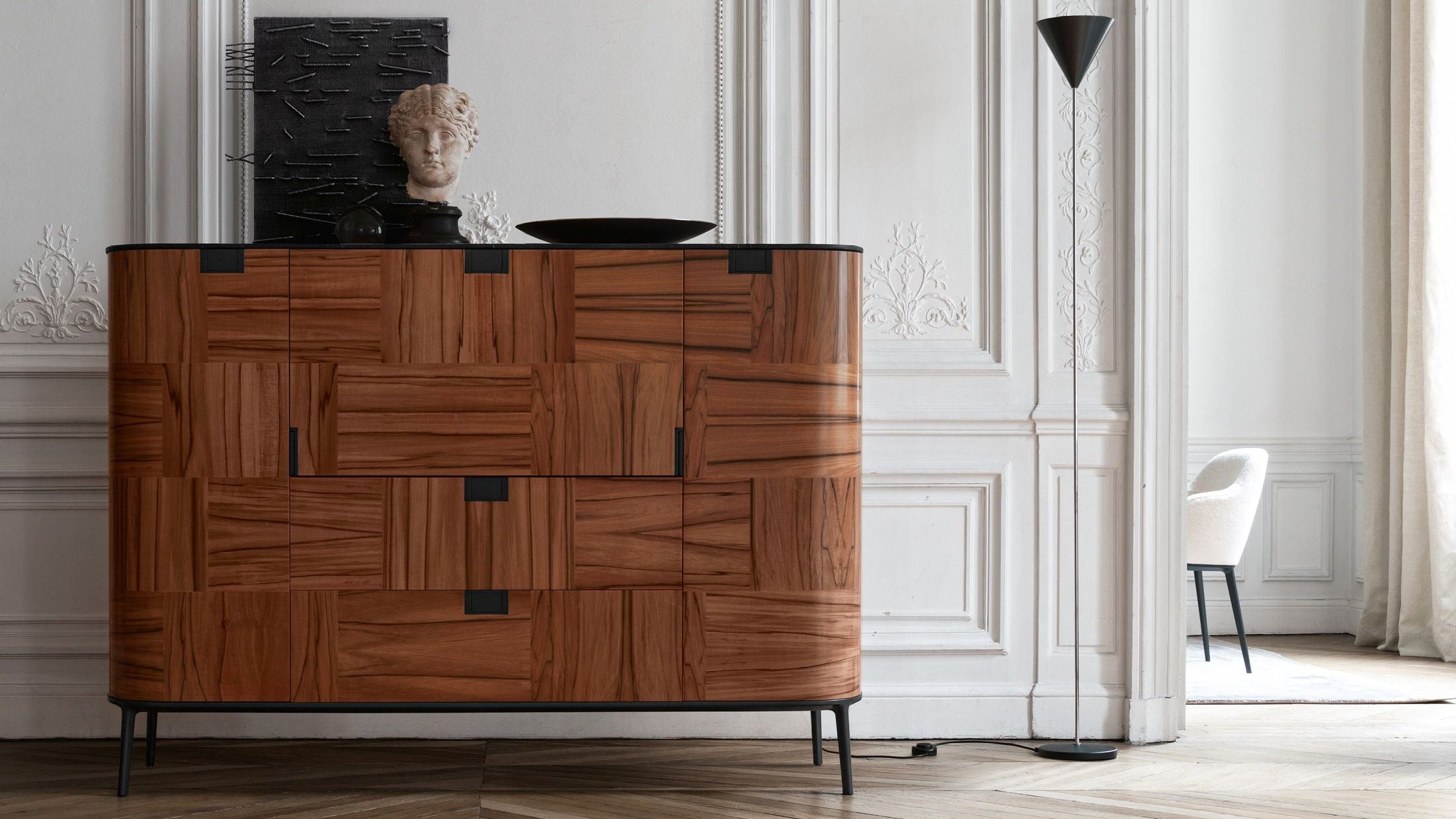 Wooden sideboard with geometric pattern in a stylish room