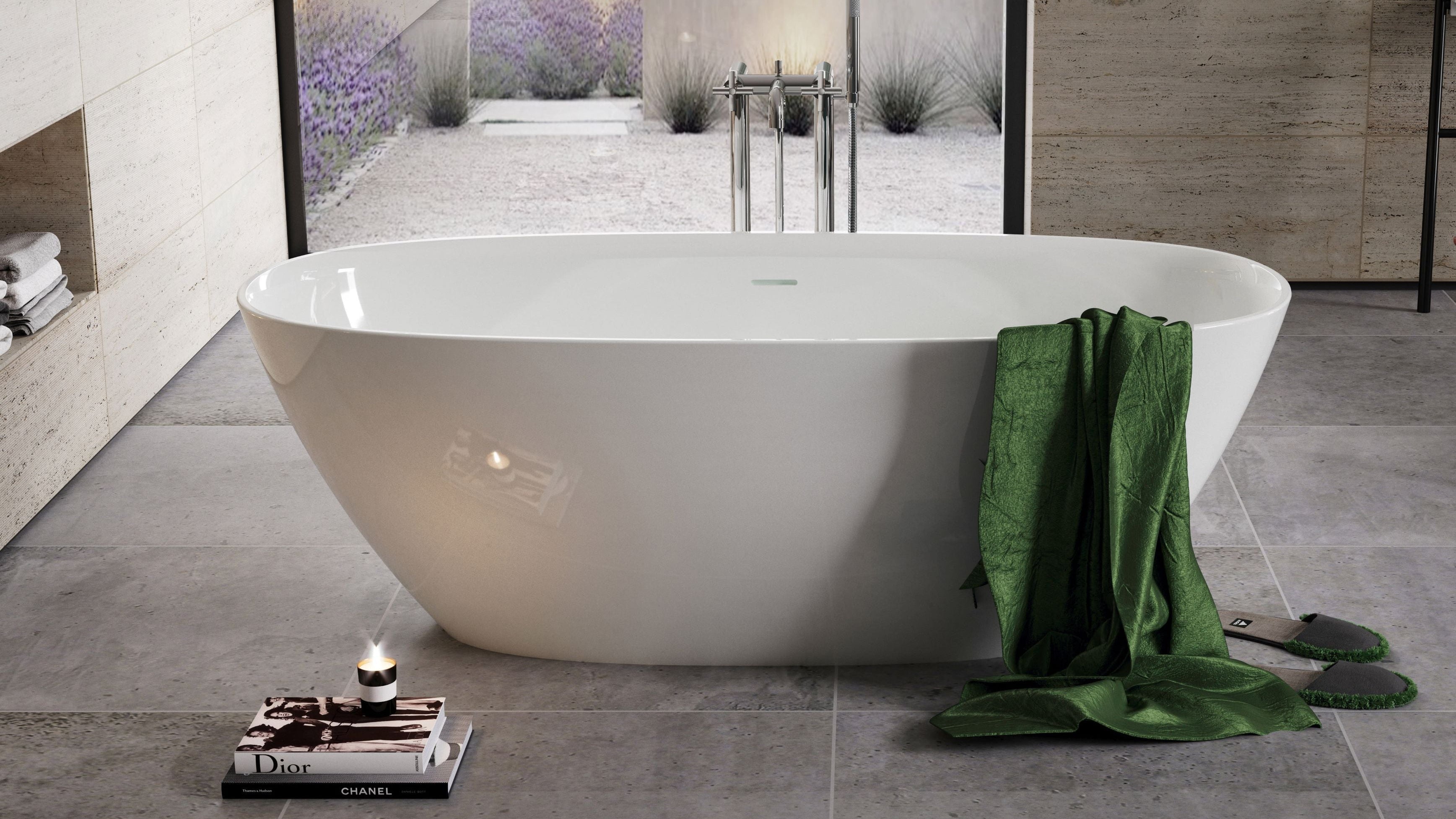 White freestanding bathtub with a green towel in a modern bathroom setting.