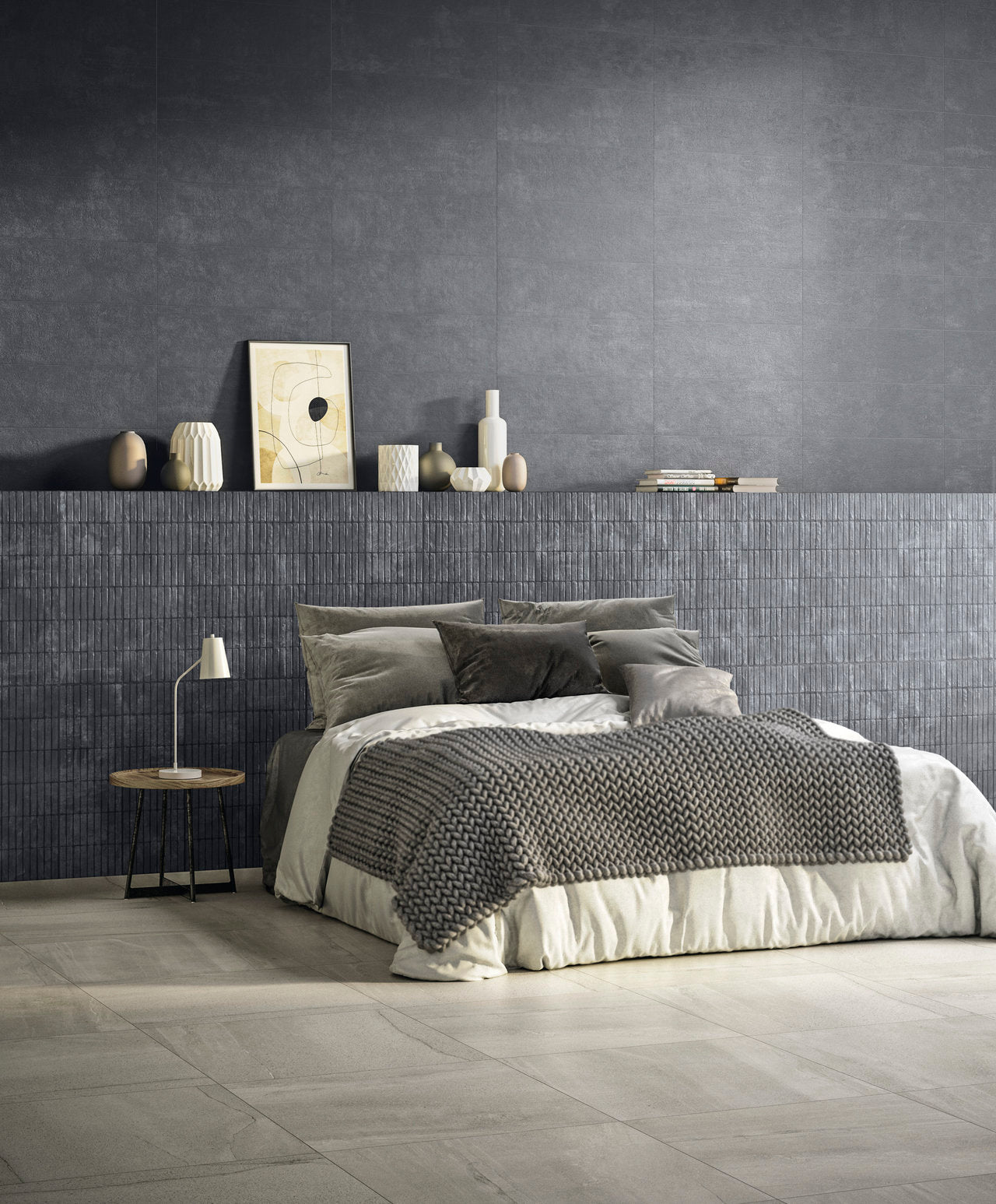 Bedroom with dark gray walls, bed, and side table.