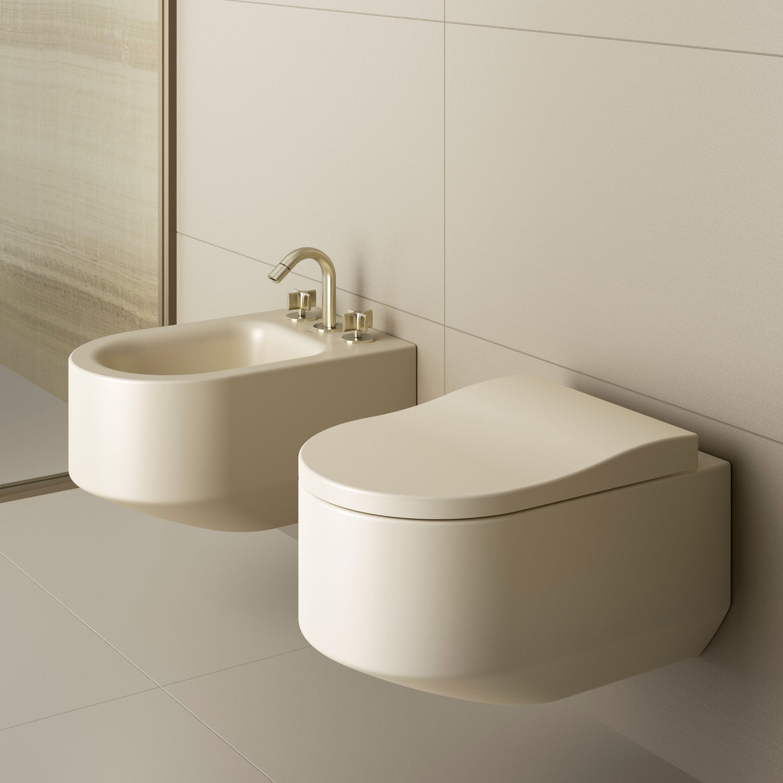 Beige wall-mounted bidet and toilet in a bathroom setting
